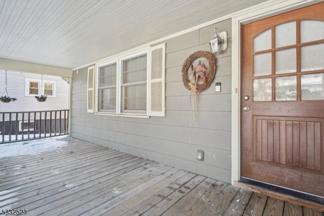 wooden deck featuring covered porch