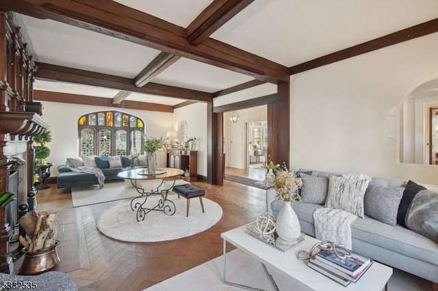 living room featuring beam ceiling and light parquet flooring