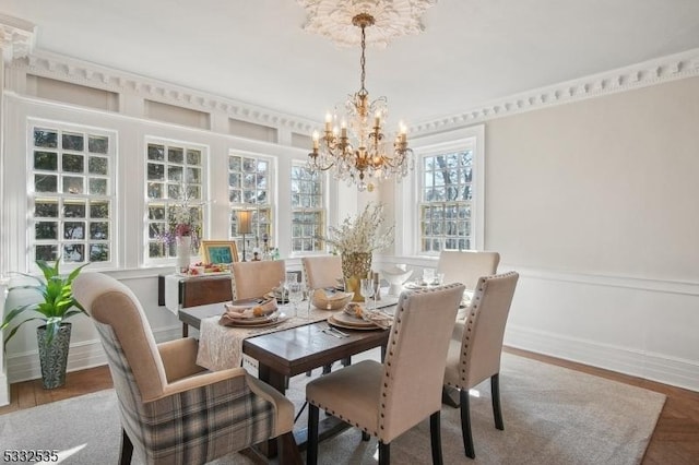 dining room featuring hardwood / wood-style floors and a notable chandelier