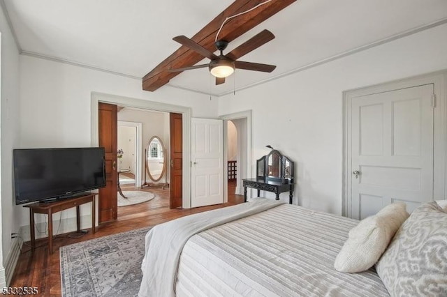 bedroom featuring ceiling fan and dark hardwood / wood-style floors