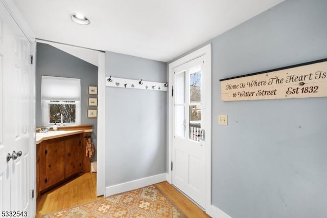 interior space with sink and light hardwood / wood-style flooring