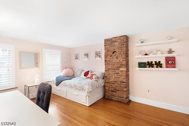 bedroom with hardwood / wood-style floors