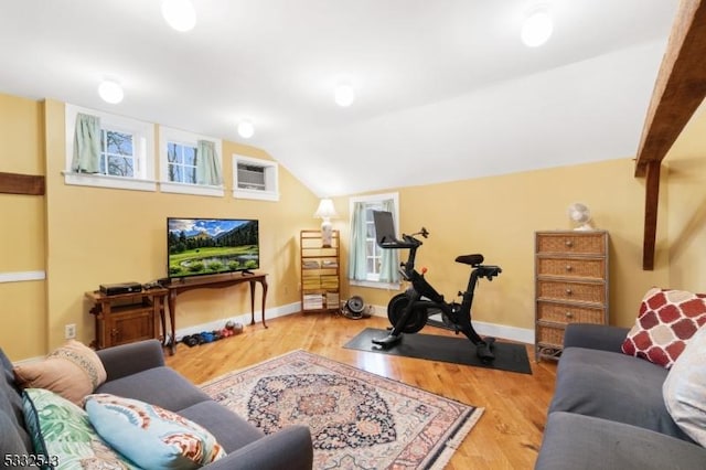 living room with light hardwood / wood-style flooring and lofted ceiling