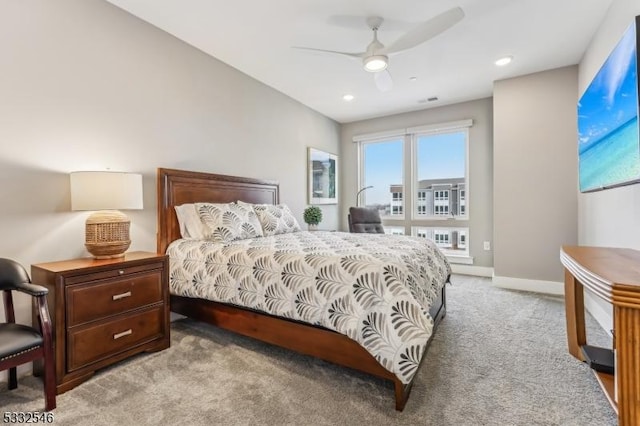 bedroom featuring ceiling fan and light carpet