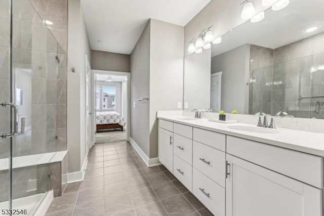 bathroom featuring tile patterned floors, vanity, and an enclosed shower