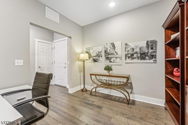 office with dark wood-type flooring