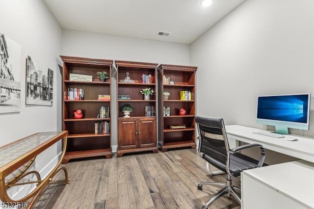 office area with hardwood / wood-style flooring