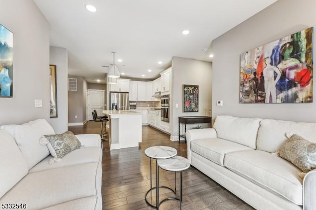 living room featuring dark hardwood / wood-style floors