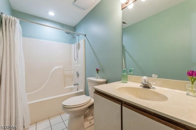 full bathroom featuring shower / tub combo with curtain, tile patterned floors, toilet, and vanity