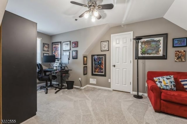 carpeted office featuring ceiling fan and vaulted ceiling