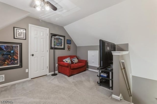 sitting room featuring lofted ceiling, light carpet, and ceiling fan