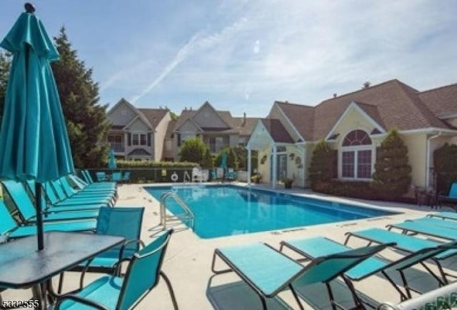 view of pool featuring a patio area