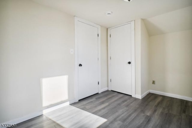 bonus room featuring dark hardwood / wood-style flooring