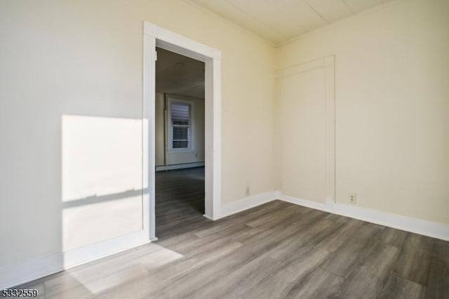 unfurnished room featuring hardwood / wood-style floors