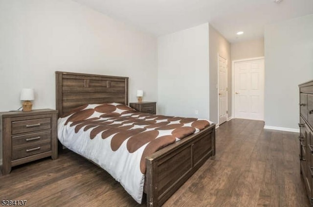 bedroom with dark wood-type flooring