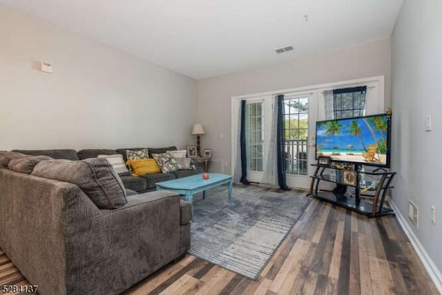 living room with dark hardwood / wood-style floors