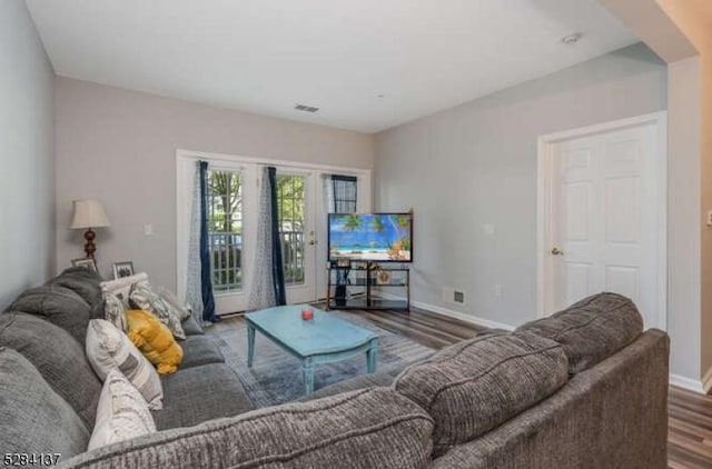 living room with dark hardwood / wood-style floors