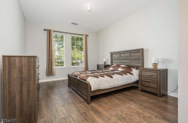 bedroom featuring dark hardwood / wood-style flooring