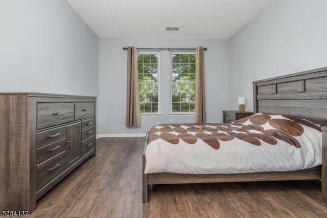 bedroom featuring dark hardwood / wood-style flooring