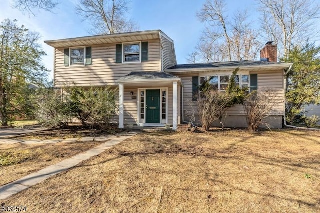 view of front of home with a front yard