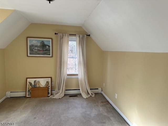 bonus room featuring lofted ceiling, baseboard heating, and light carpet