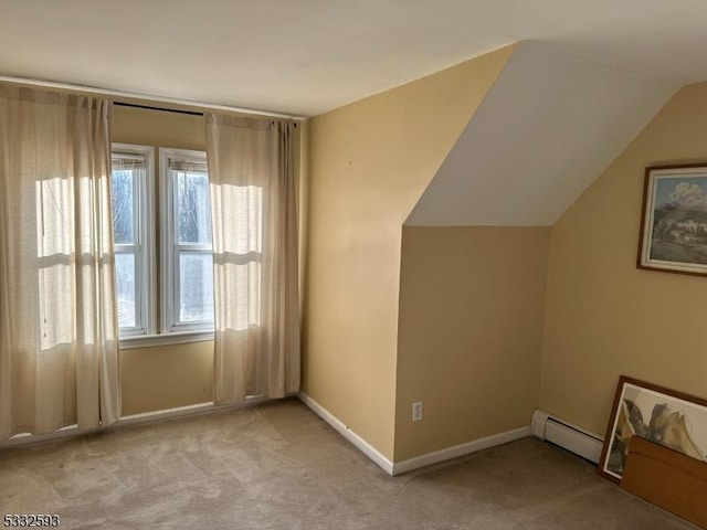 bonus room with light colored carpet, vaulted ceiling, and a baseboard heating unit