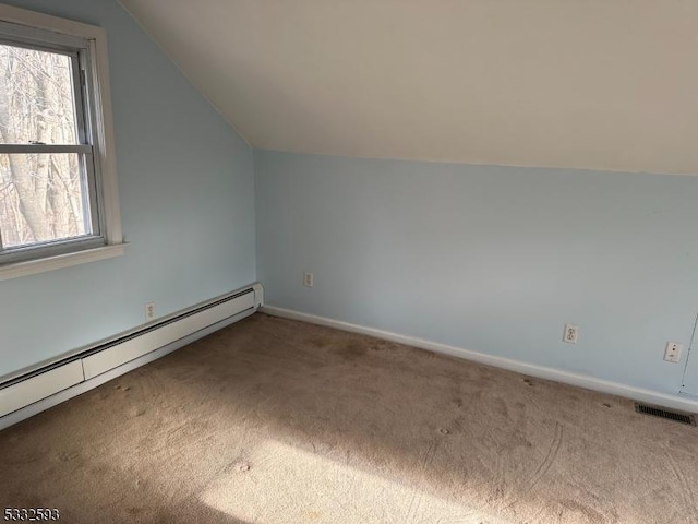 bonus room featuring carpet flooring, a baseboard radiator, and lofted ceiling