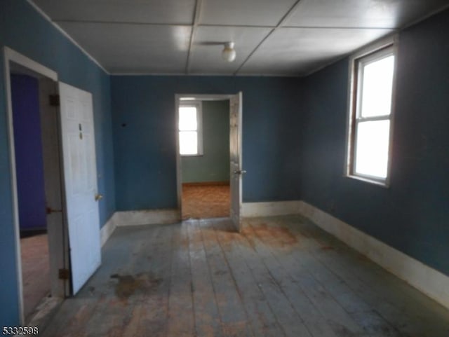 empty room featuring wood-type flooring