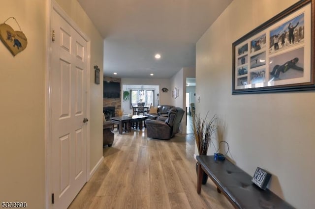 hall with light hardwood / wood-style flooring