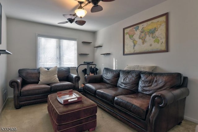 carpeted living room featuring ceiling fan