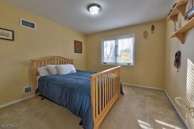 bedroom featuring light carpet