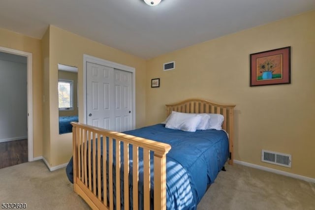 carpeted bedroom featuring a closet