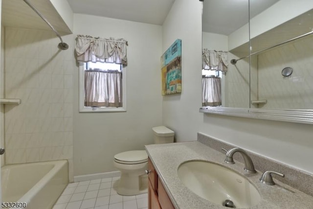 full bathroom featuring tiled shower / bath, tile patterned floors, vanity, and toilet