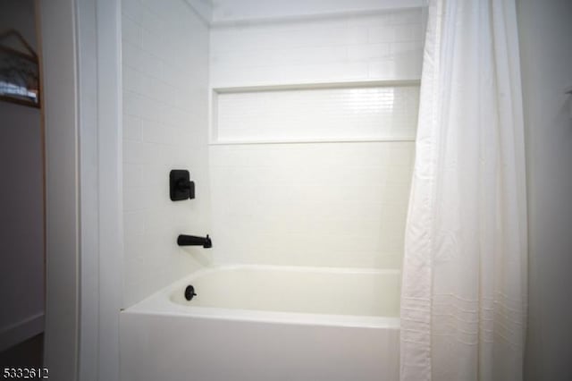 bathroom featuring shower / bath combination with curtain