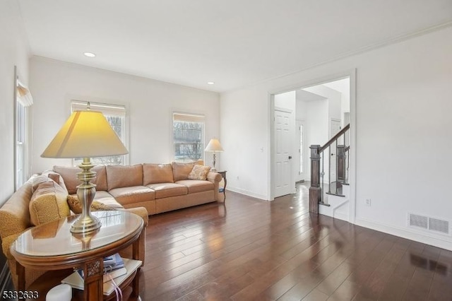 living room with dark hardwood / wood-style flooring