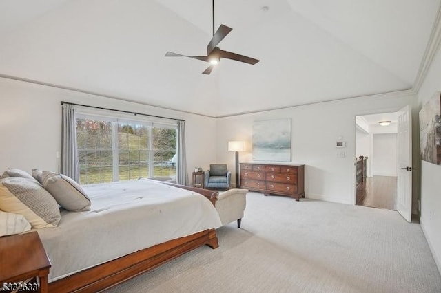 carpeted bedroom with ceiling fan and high vaulted ceiling