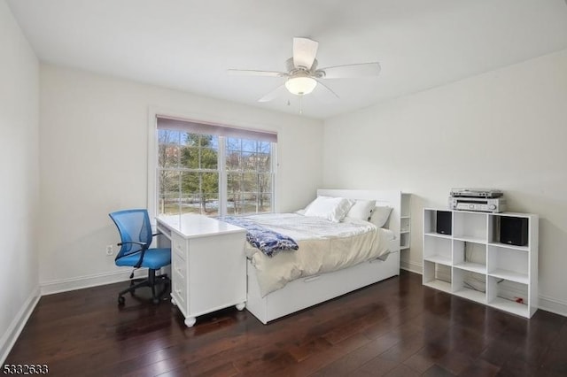 bedroom with ceiling fan and dark hardwood / wood-style flooring