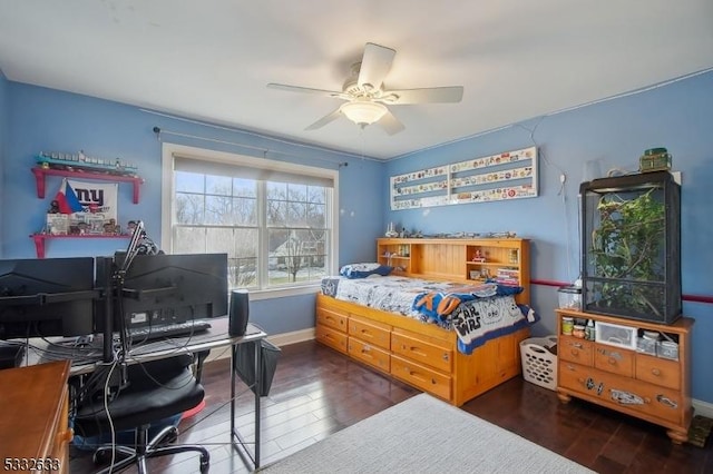 bedroom featuring dark hardwood / wood-style flooring and ceiling fan