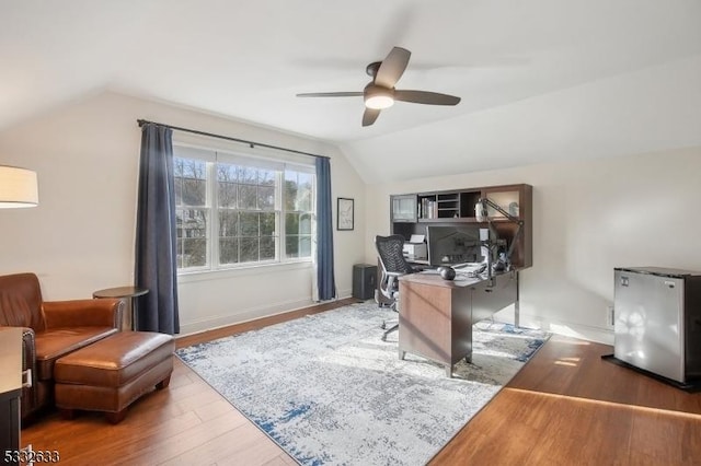 office with hardwood / wood-style flooring, vaulted ceiling, and ceiling fan