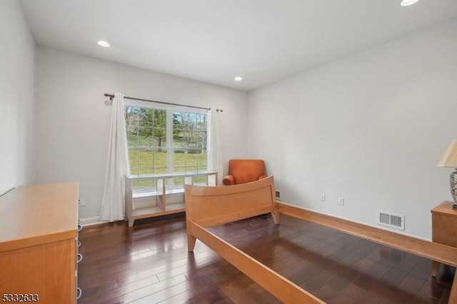 bedroom featuring dark hardwood / wood-style floors