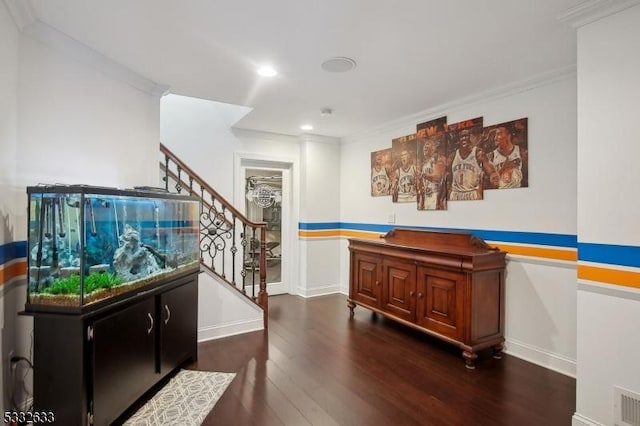 misc room with crown molding and dark hardwood / wood-style floors