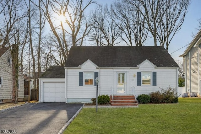 view of front facade featuring a front yard and a garage