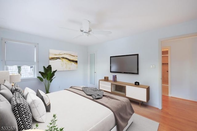 bedroom with ceiling fan and light hardwood / wood-style flooring