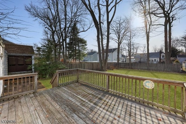 wooden terrace featuring a yard