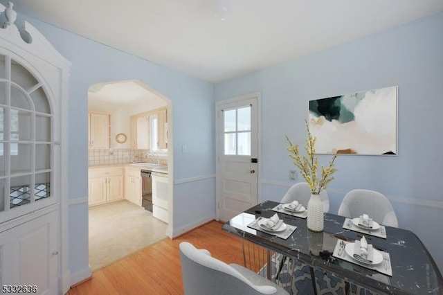 dining area featuring light wood-type flooring