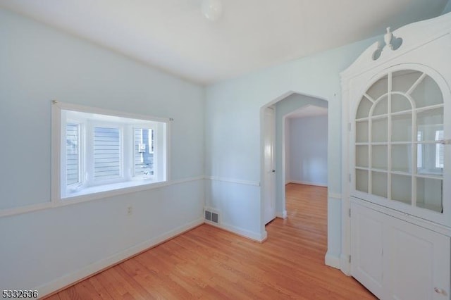 spare room with light hardwood / wood-style flooring