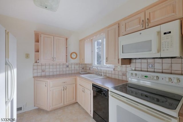 kitchen featuring white appliances, tasteful backsplash, light brown cabinetry, and sink