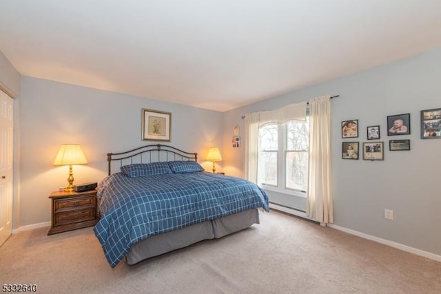 bedroom featuring light carpet and a baseboard heating unit