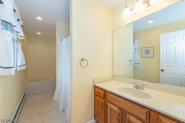 bathroom featuring baseboard heating, tile patterned flooring, vanity, and walk in shower