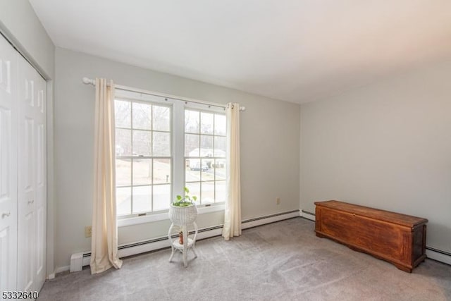 miscellaneous room featuring light carpet